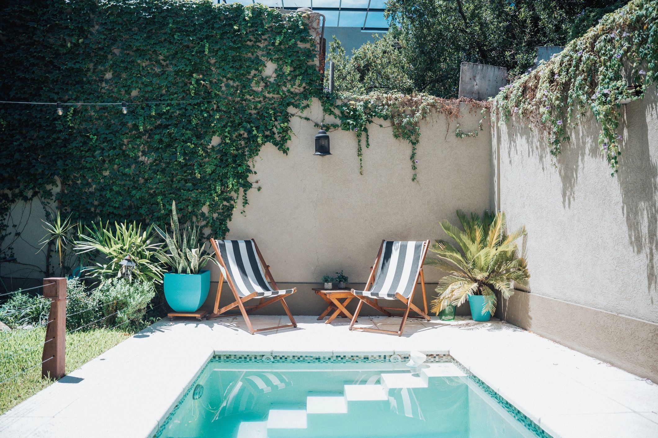 Patio lounge area with poolside seating